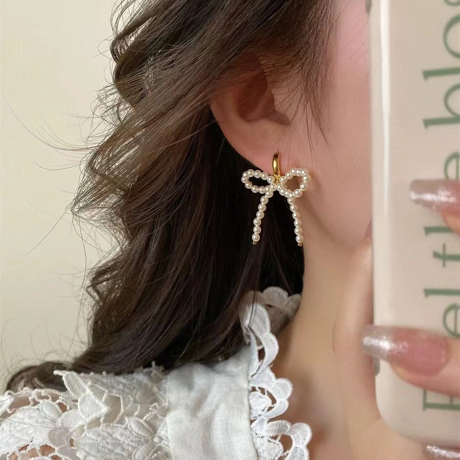 Wholesale Lady-style bow pearl earrings